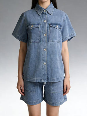 Button-up denim top and shorts set in sky blue with collared neckline and short sleeves.