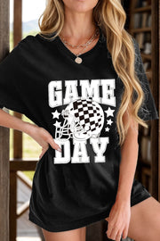 Black graphic tee with checkerboard helmet and "GAME DAY" text.