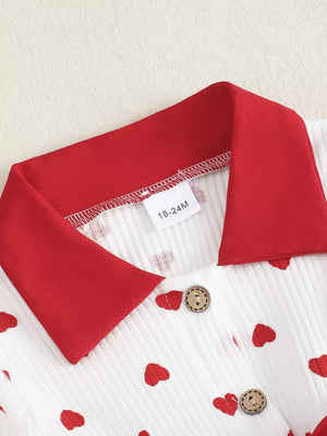 Baby dress with red hearts pattern, white ribbed cotton, red collar, and wooden buttons.