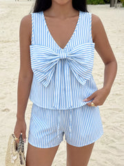 Blue and white striped two-piece set with a large bow detail on the top and drawstring shorts.