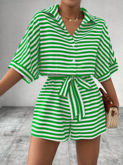 Green and white striped shirt romper with button front and self-tie belt.