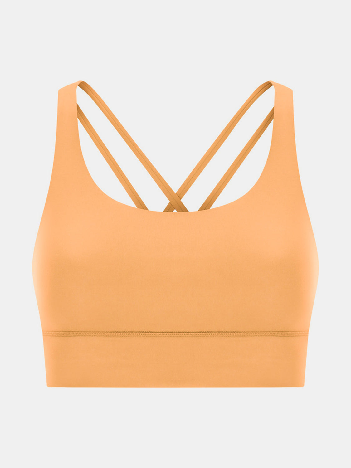 Performance bra in gold with crisscross straps and scoop neckline.