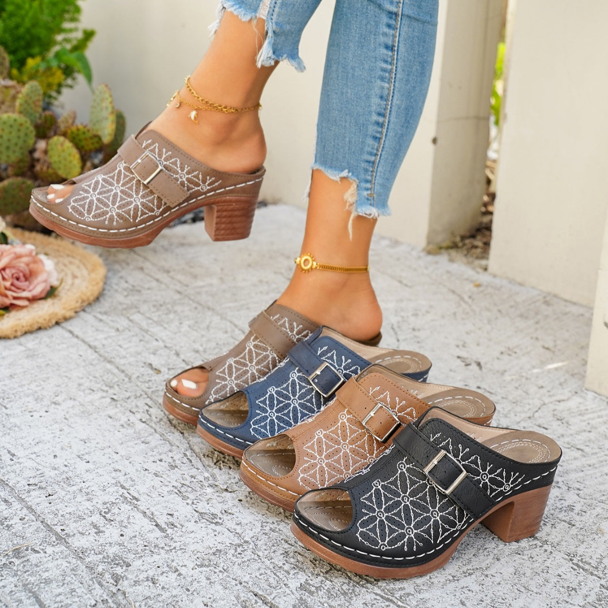 Chic buckle-embellished mid heel sandals in khaki, blue, tan, and black with white geometric embroidery.