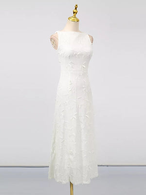 White A-line midi dress with floral applique and boat neck.