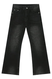 Dark wash denim trousers with exaggerated flare, 70s style.