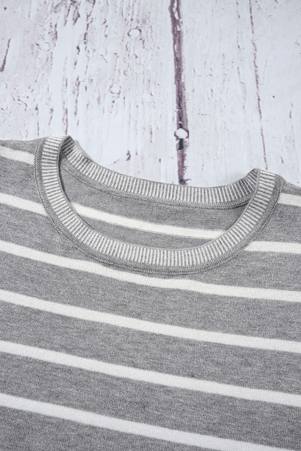 Light gray and white striped knit tee with contrast ribbed neckline.