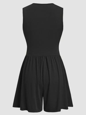 Black ribbed plunge romper with a gathered waist and flared shorts.