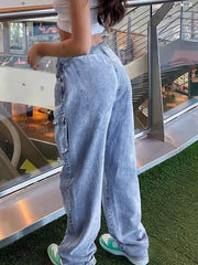 Light wash denim relaxed high-waisted cargo pants with drawstring waist and side pocket.