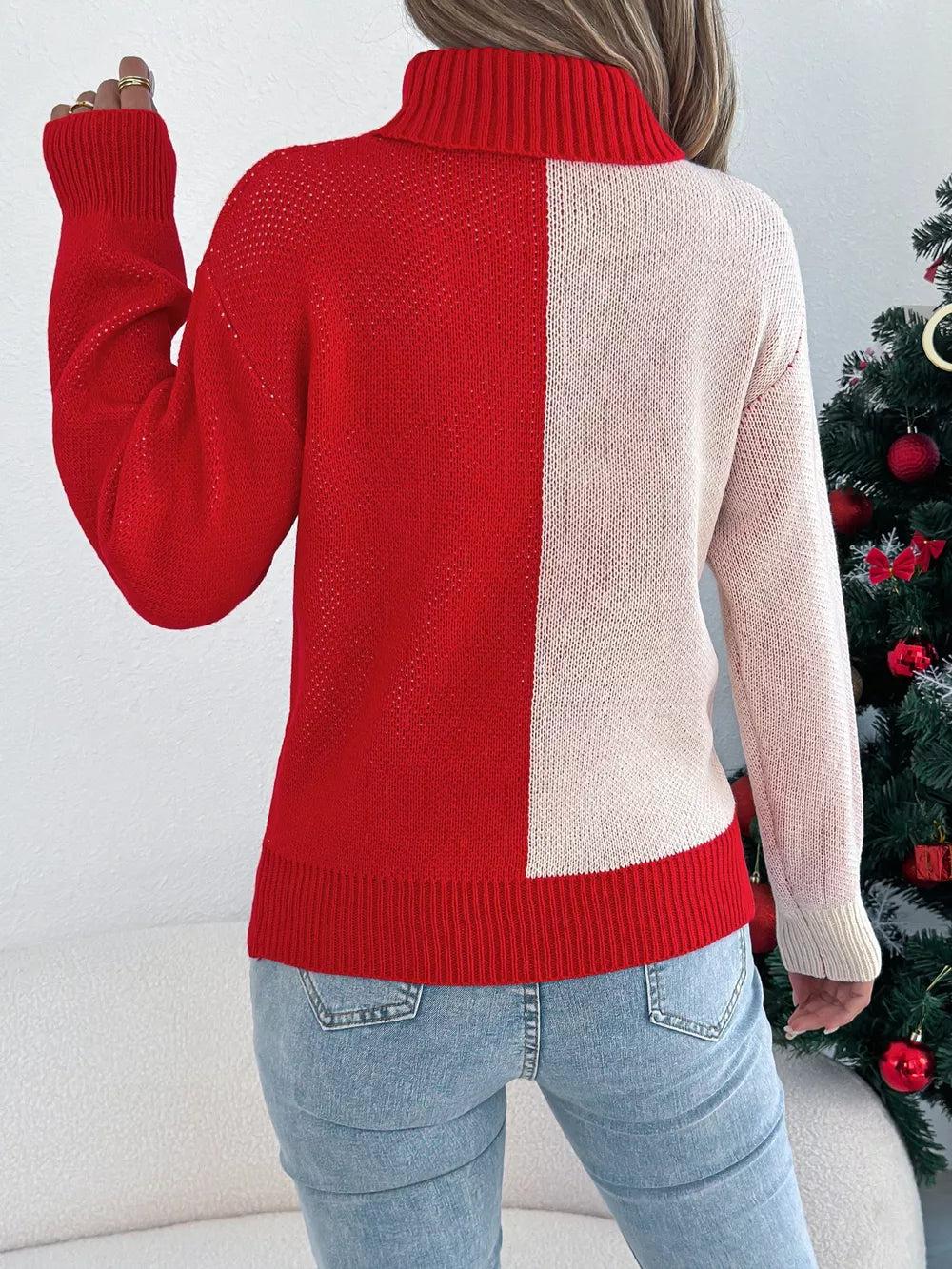 Red and cream colorblock turtleneck sweater with ribbed cuffs and hem.