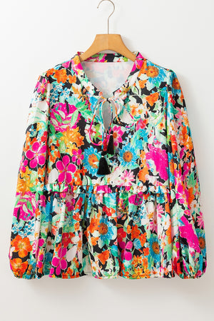 Floral print blouse with tie neck and tassel trim, tiered hem, long sleeves