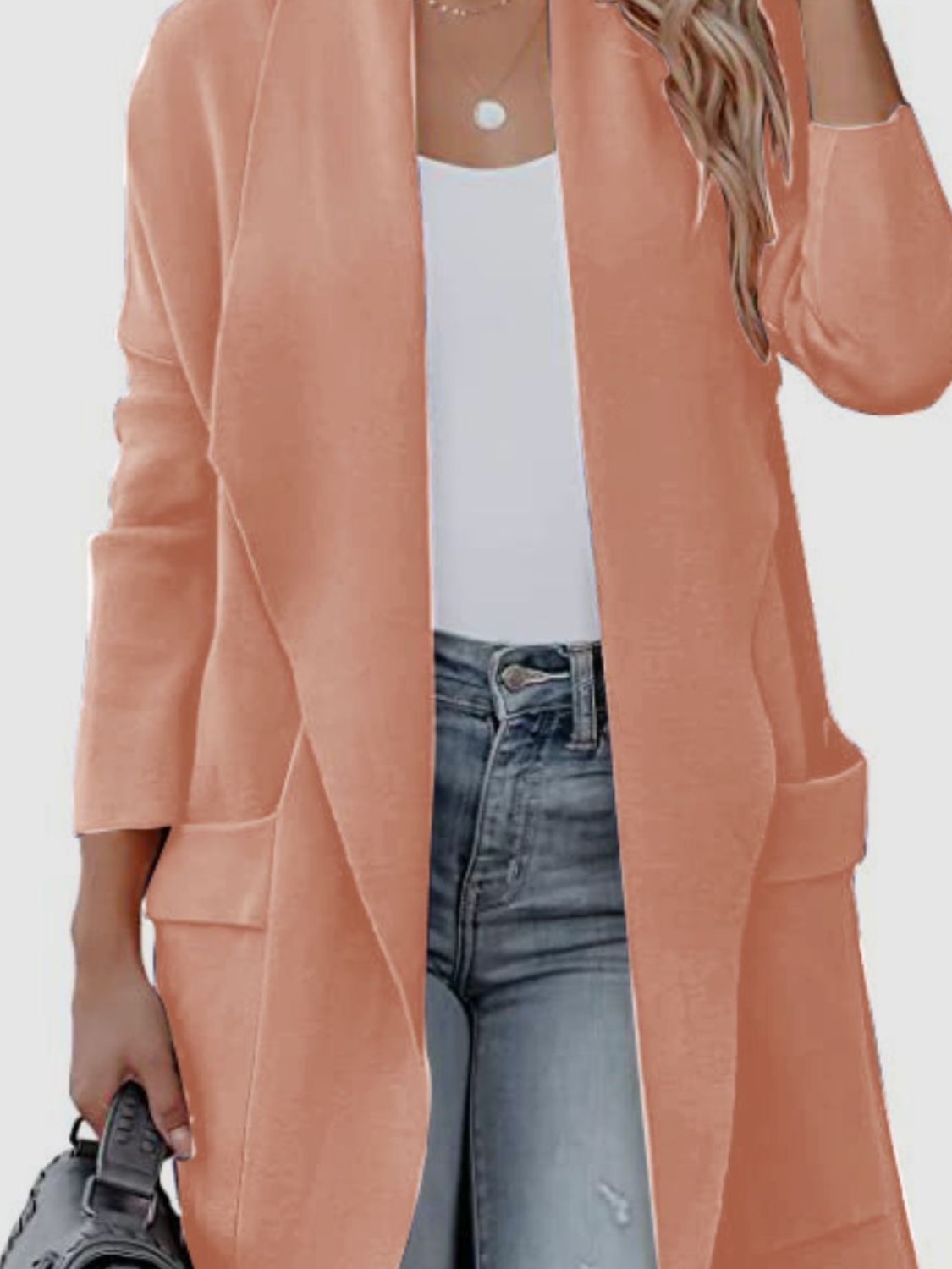 Coral open-front duster cardigan with pockets and a relaxed fit, styled with a white tank and jeans.