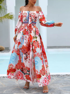 Vibrant off-shoulder maxi dress with balloon sleeves, floral print, and a high slit.