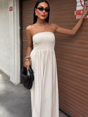 Beige smocked bodice relaxed maxi dress with a strapless neckline.
