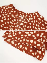 Orange animal print midi dress with button-down detail and tied waist