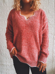 Red Orange acrylic knit sweater with scalloped V-neck and ribbed cuffs.