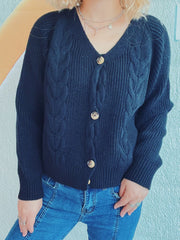 Black cable knit raglan cardigan with button front and V-neck