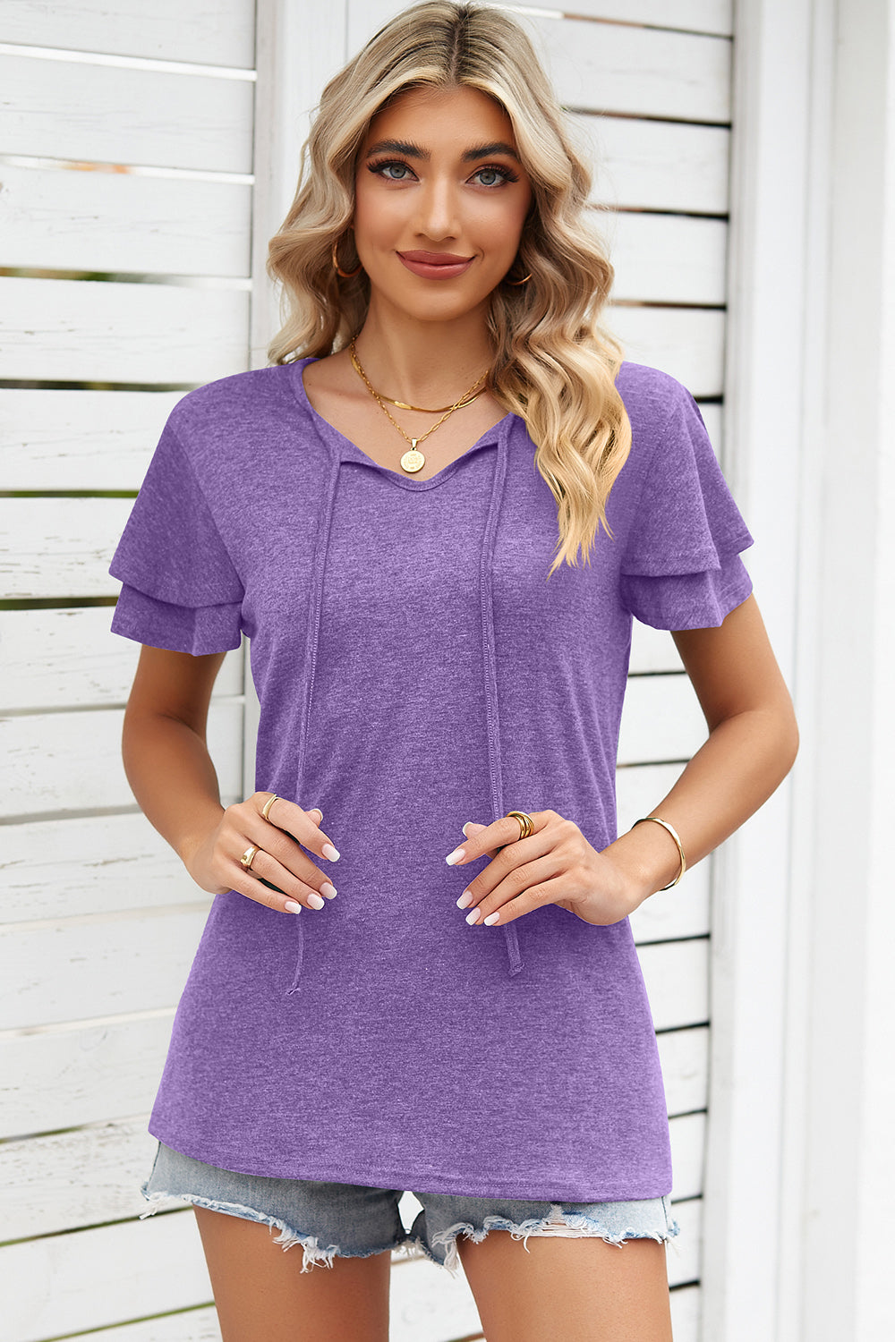Flutter sleeve henley tee in lavender with tie-neck detail and layered sleeves.