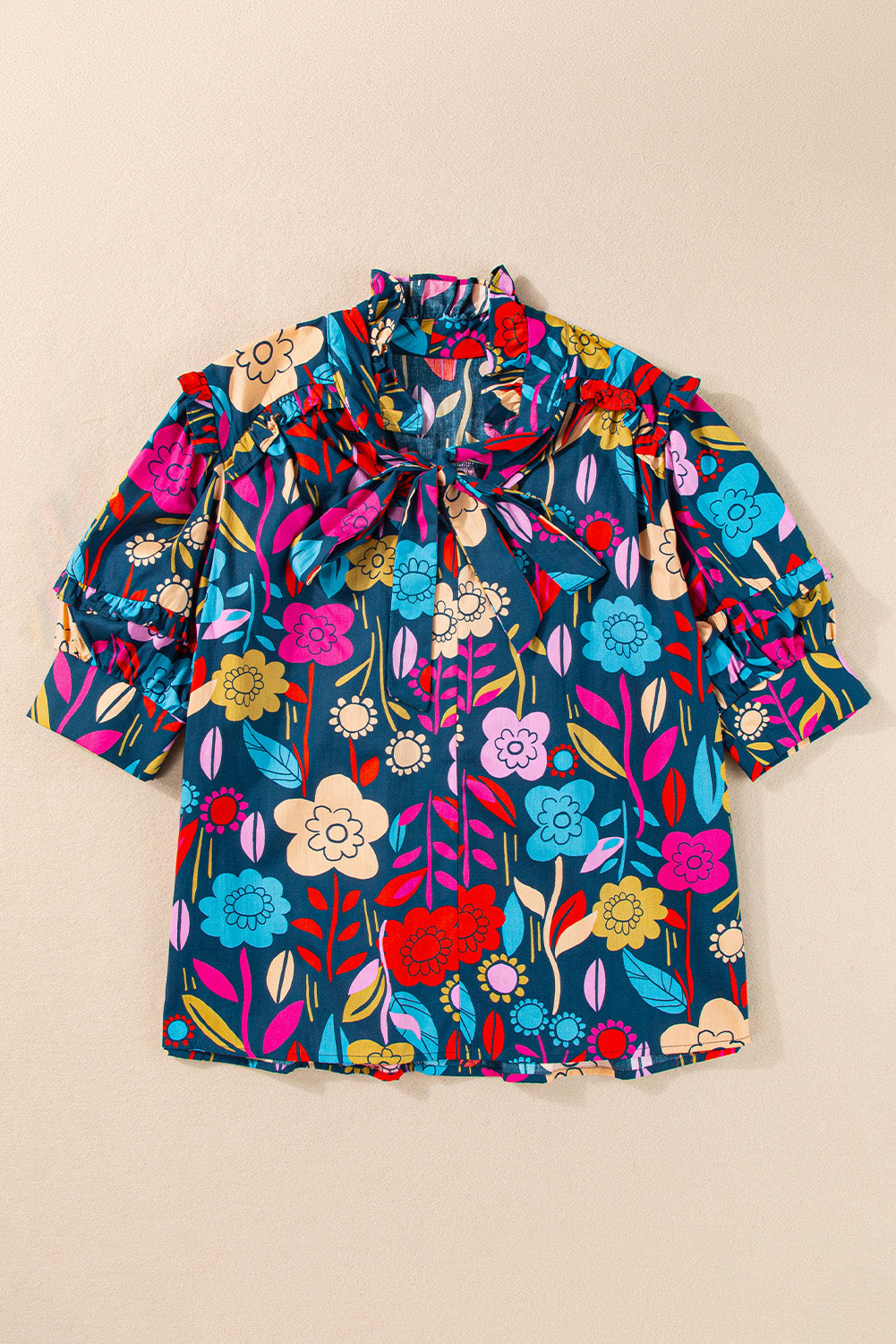 Botanical ruffle-sleeve tie-neck blouse in floral print with ruffled cuffs.