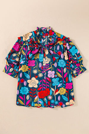 Botanical ruffle-sleeve tie-neck blouse in floral print with ruffled cuffs.