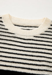 Textured stripe knit sleeveless top in black and cream with a crew neck.