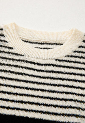 Textured stripe knit sleeveless top in black and cream with a crew neck.