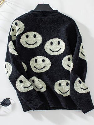 Black intarsia knit sweater with allover smiley face pattern and crewneck.