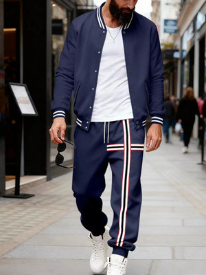 Navy blue tracksuit set with white stripes on jacket sleeves and pants.
