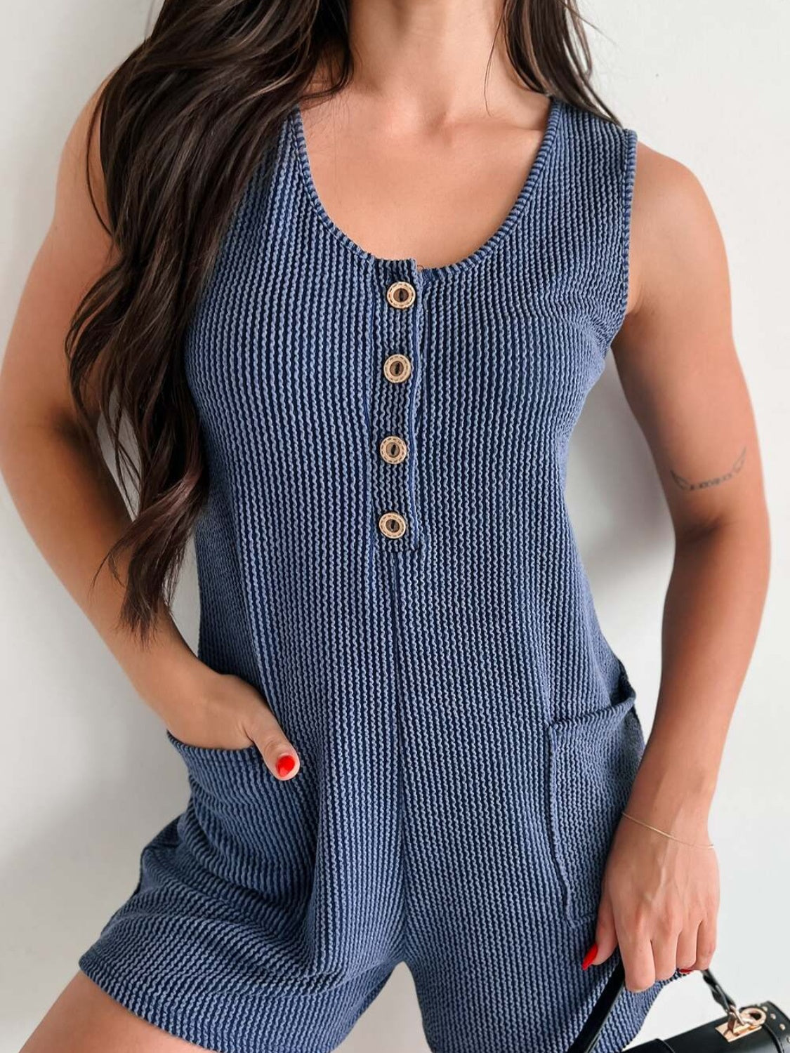 Textured indigo button-down pocket romper with gold buttons and scoop neck.