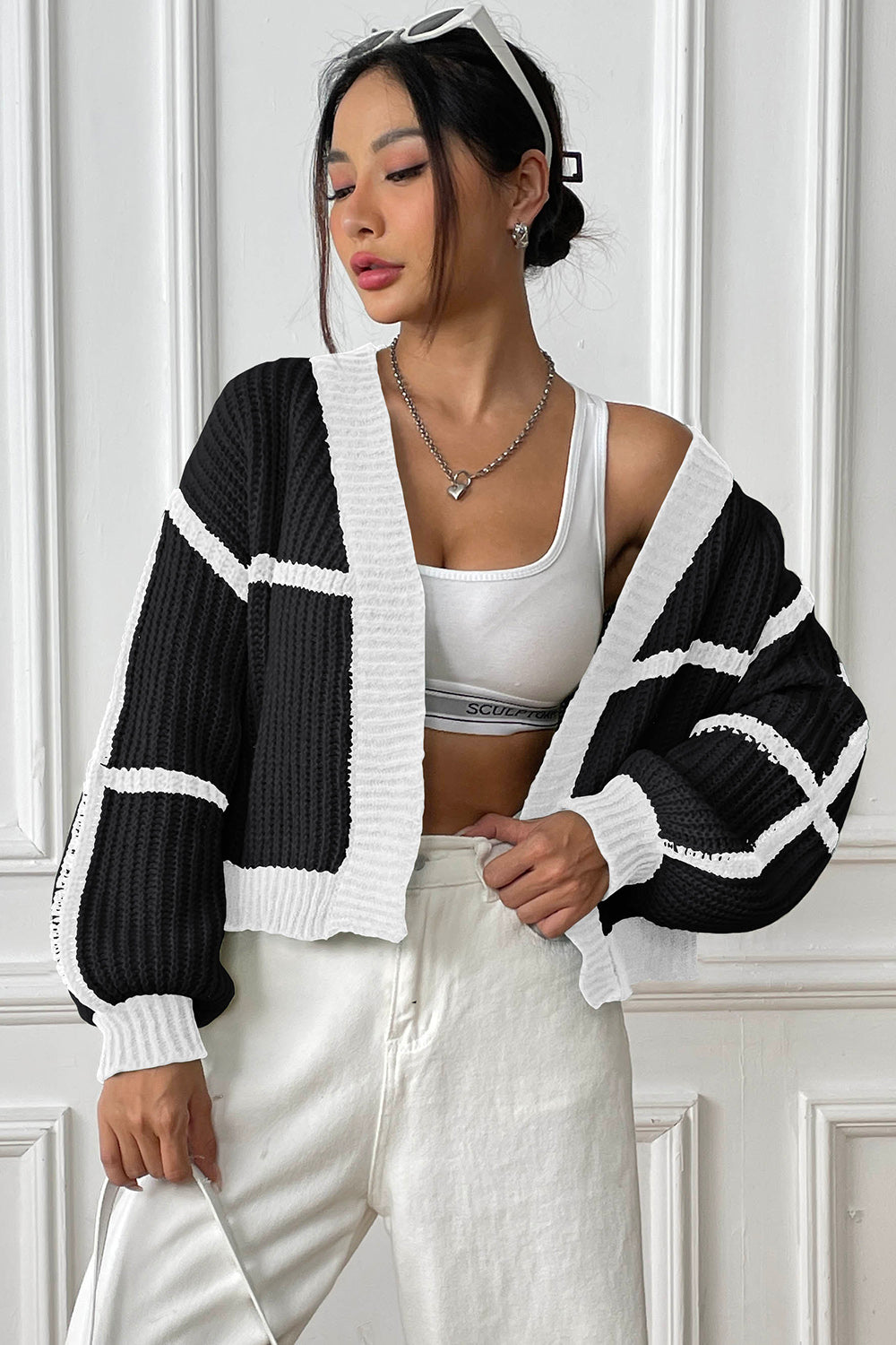 Colorblock ribbed open cardigan in black and white with a relaxed fit and balloon sleeves.