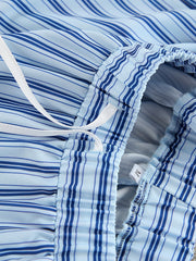 Blue striped pajama shorts with drawstring waist and ruffled hem detail.