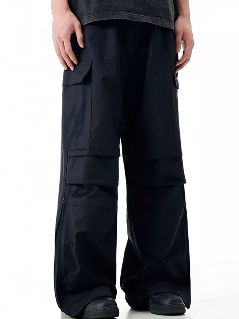 Black cargo sweatpants with multiple pockets and a relaxed fit.
