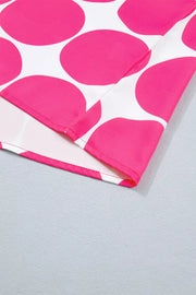 Polyester tank top with playful pink polka dots and frill detail.