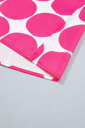Polyester tank top with playful pink polka dots and frill detail.