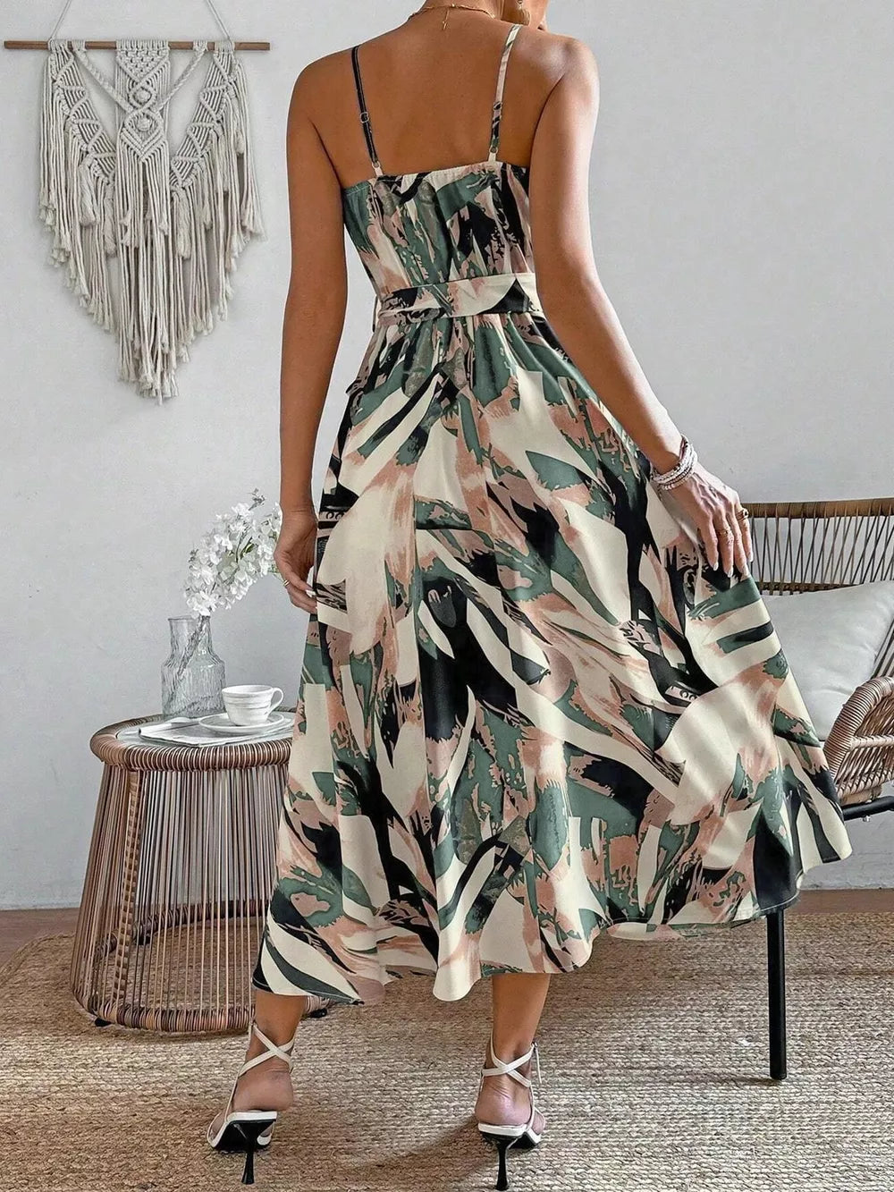 Vibrant abstract print cami dress with a belted waist and midi hem in fuchsia pink, army green, and cream.