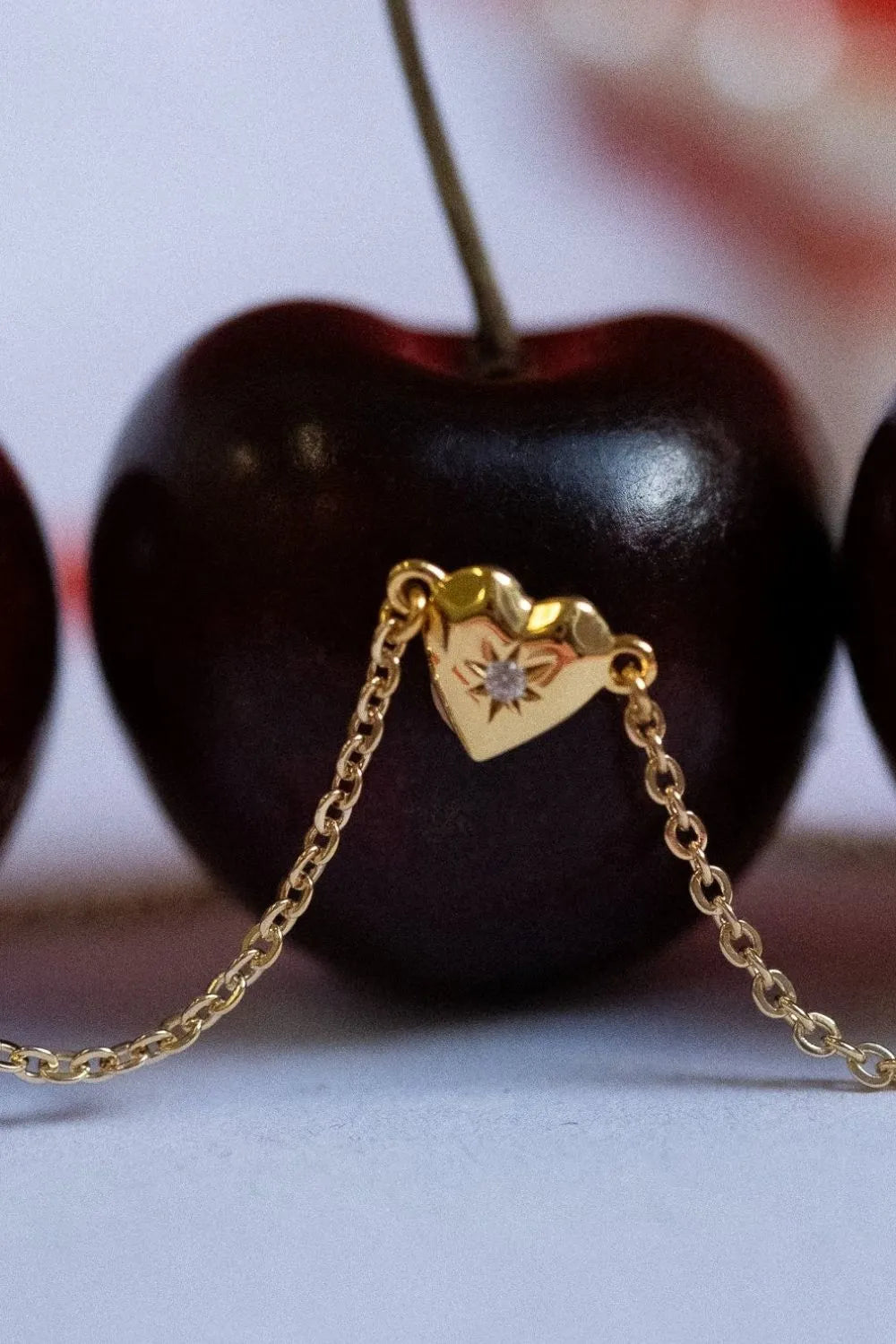 Gold heart pendant necklace with diamond accent and delicate chain