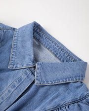 Denim ruffle yoke shirt in medium wash cotton with a collar detail.