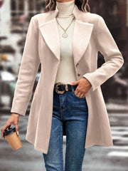 Dust Storm wool blend coat with buttoned front and flared hem, styled with jeans.