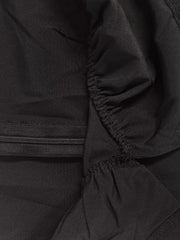 Black midi dress with ruched detail and elastic waistband.