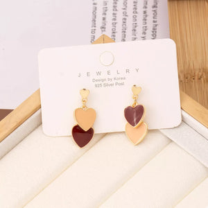 Charming double heart enamel earrings in burgundy and peach with gold posts.
