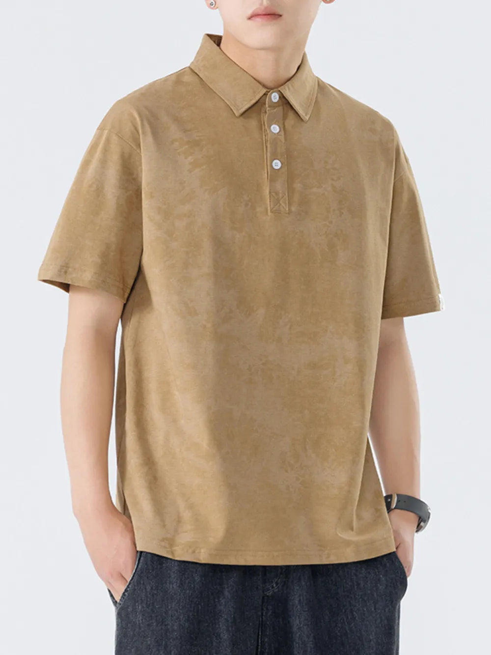 Brown cotton polo shirt with subtle texture and buttoned placket.