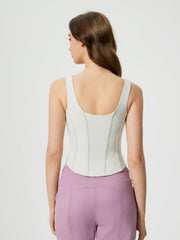 Light blue sculpted seam tank top with built-in support and curved hem.