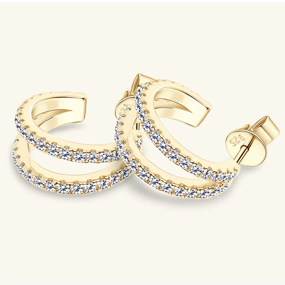 Gold double-band hoop earrings with moissanite accents.