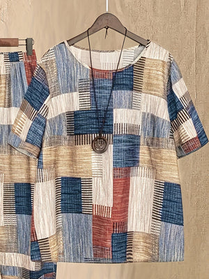 Multicolor patchwork print half sleeve top with round neck, paired with matching pants.