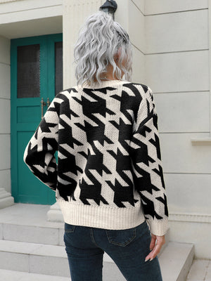 Geometric houndstooth V-neck acrylic cardigan with button front and ribbed trim.