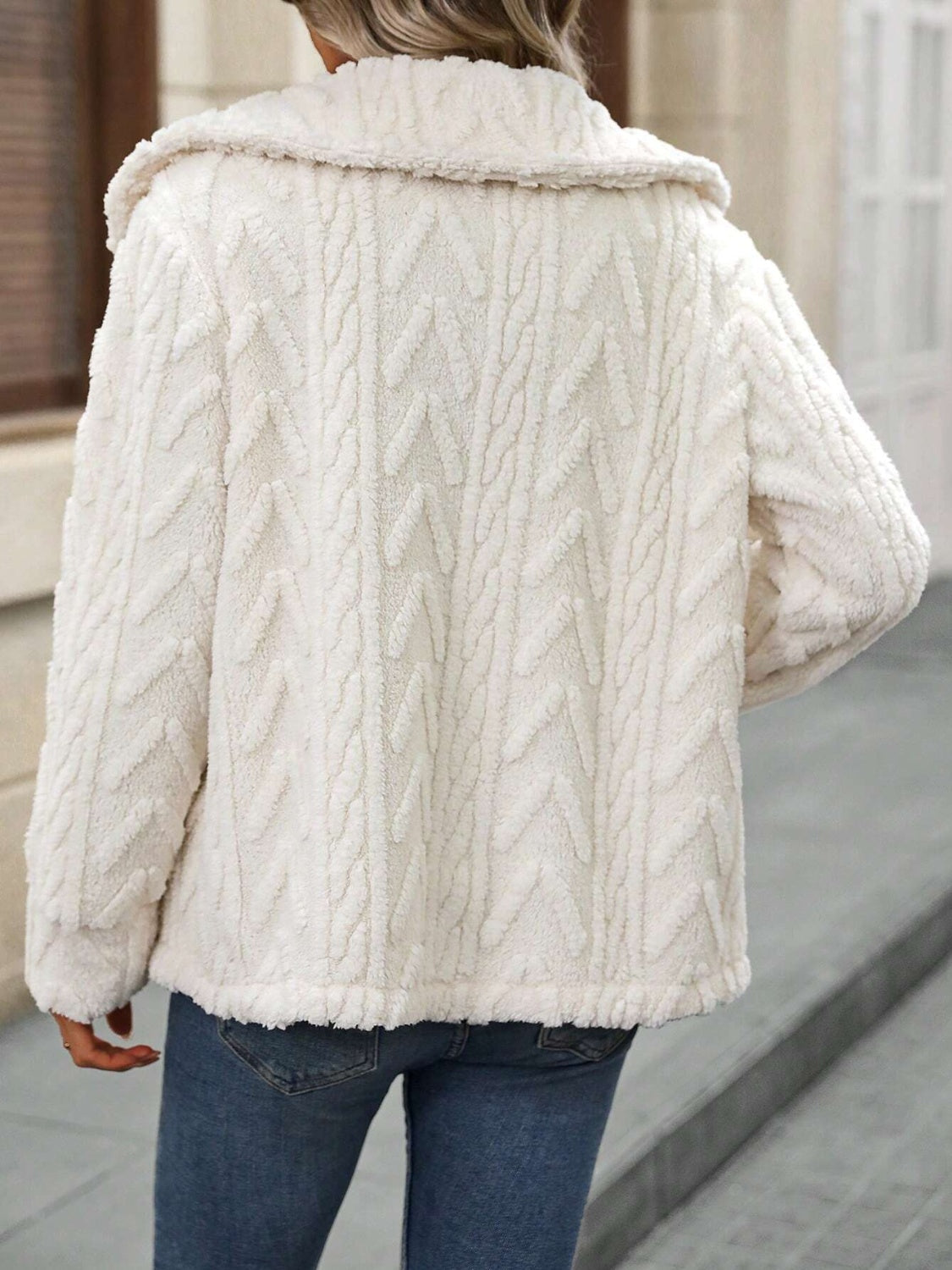 Cream cable knit collar jacket with textured pattern and fuzzy finish.