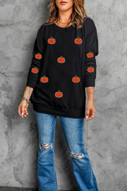 Black sweatshirt with allover embroidered pumpkins, crew neck, long sleeves.