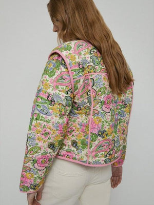 Paisley quilted jacket in blush pink with pink trim and tie closure.
