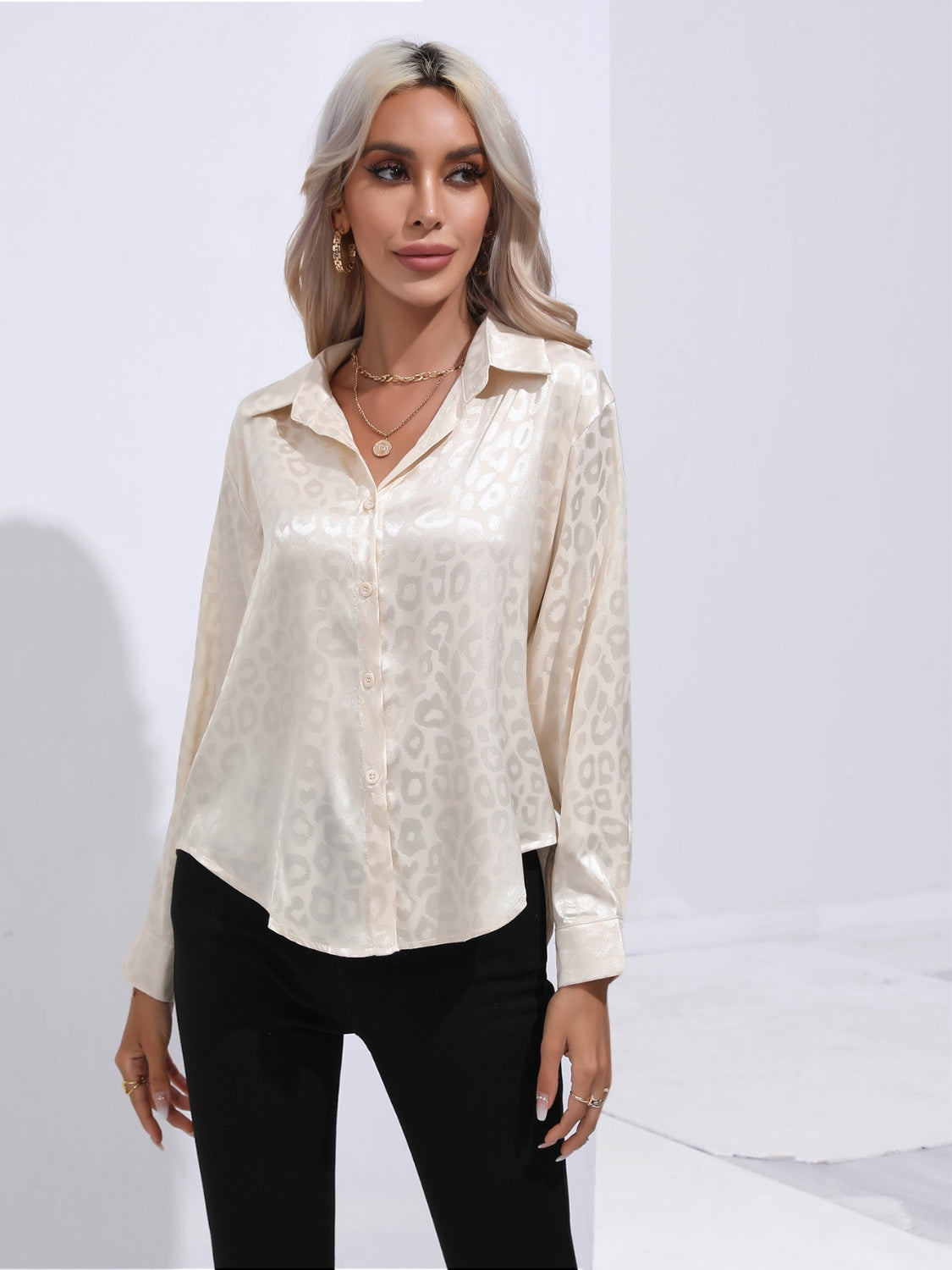 Cream satin leopard print blouse with button front and collared neckline
