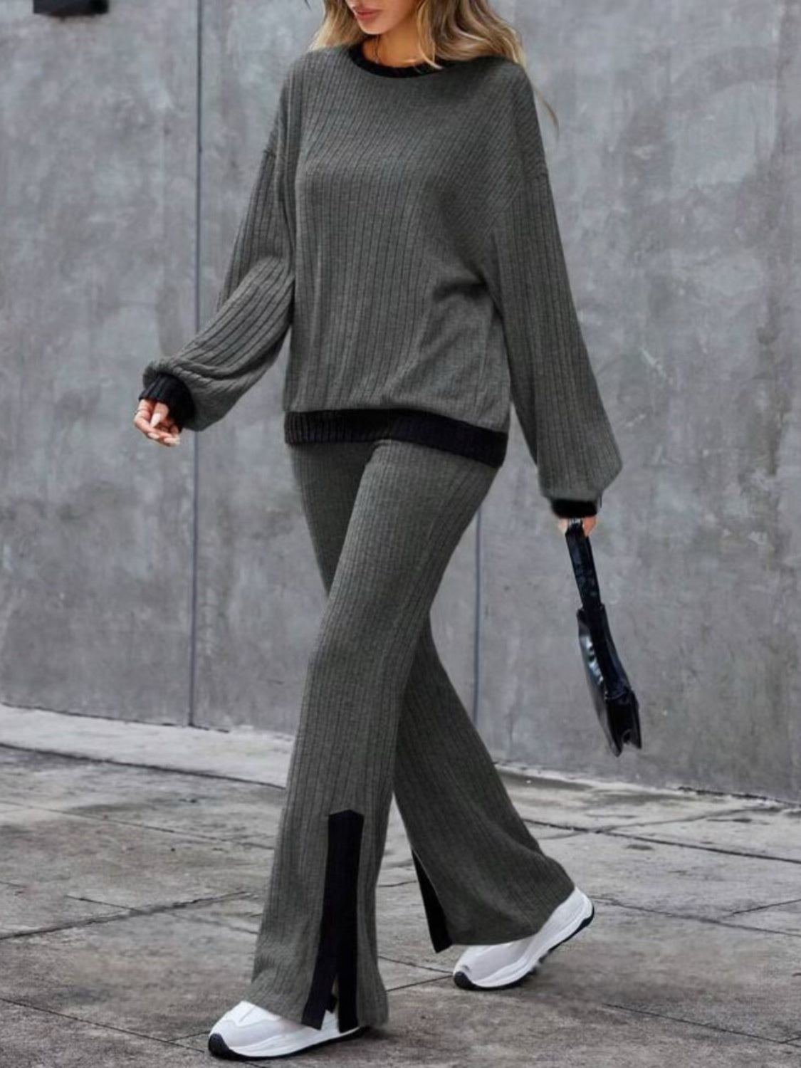 Gray ribbed knit lounge set with crew neck sweater and slit hem pants.