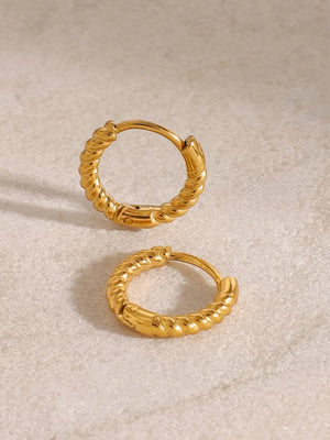 Twisted gold mini hoop earrings with a textured rope design.
